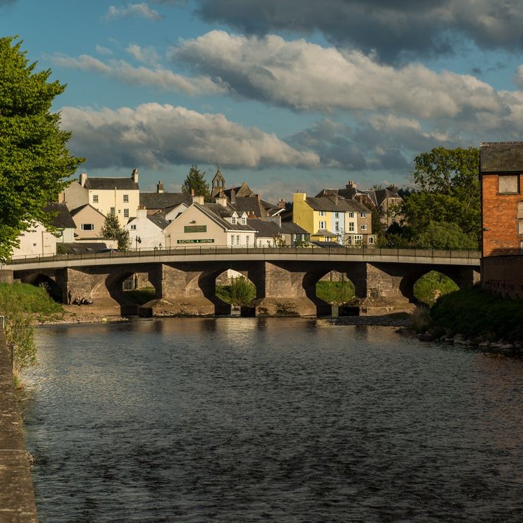 Stone bridge over river in a village